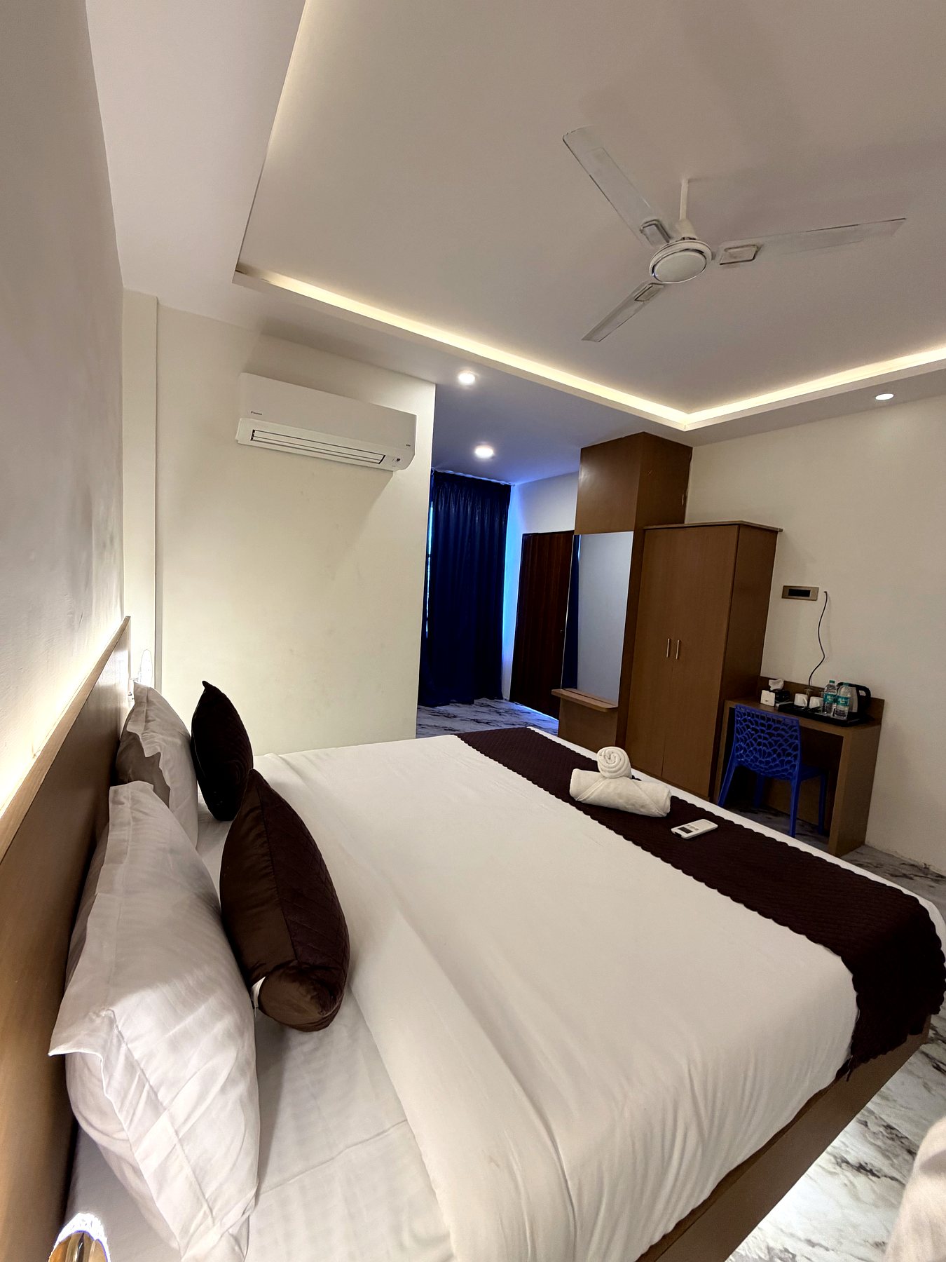 Family room with wardrobe, desk and king bed